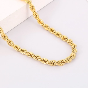 Close-up of gold-plated twisted rope chain necklace showing fine metallic texture