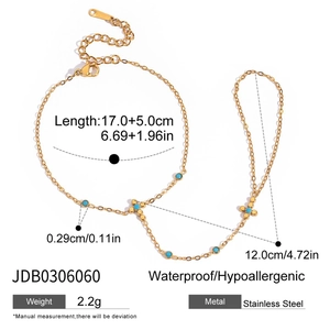 Detail of gold finger bracelet with blue beads and cross, 17+5cm stainless steel chain