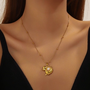 Gold plated puppy pendant necklace with pearl detail on a thin beaded chain for women