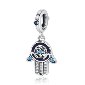 Macro shot of S925 sterling silver Hamsa hand charm with blue and white zircon stones