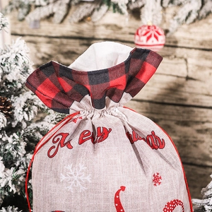 Christmas burlap gift bag with red plaid trim and Merry Christmas print for holiday decor
