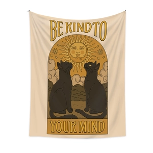 Detail of bohemian tapestry featuring sun, moon, and black cat with Be Kind To Your Mind text