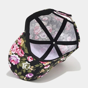 Ethnic floral canvas baseball cap featuring a black base with pink rose patterns