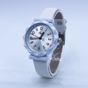 Minimalist white silicone watch with silver wave-edge dial and black Arabic numerals