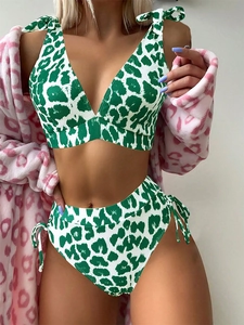 Detail of green leopard print bikini with ribbed texture and side bow decoration