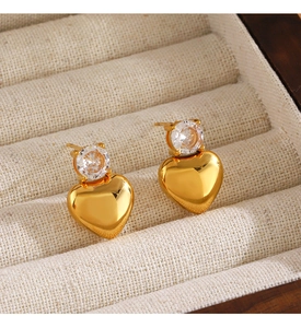 Close-up of heart earrings in 18K gold plating with sparkling cubic zirconia inlay