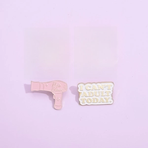 Set of cartoon enamel pins with creative slogans on a soft purple background
