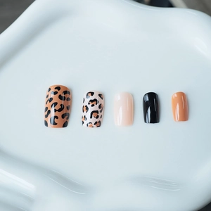 Classic leopard print and solid color medium square press-on nails set on white tray