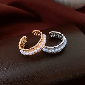 18K gold plated pearl hollow open rings in gold and silver finish on a luxury base