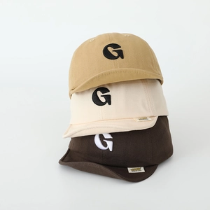 Three minimalist baby cotton baseball caps with G embroidery in khaki, beige and brown