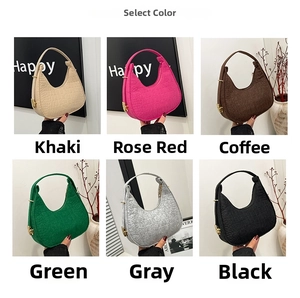 Detail view of crocodile pattern faux leather half-moon bags in six assorted colors