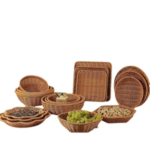 Brown woven plastic fruit baskets in various shapes for kitchen and table storage
