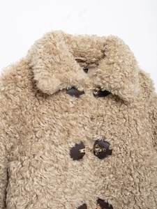 Loose-fit light brown fleece jacket with warm fur texture and metal horn buckles