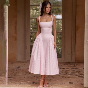 Detail of a pink plaid backless midi dress with waisted design and A-line skirt