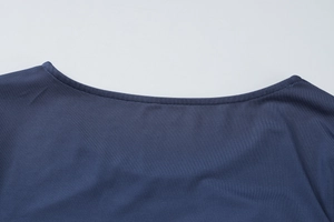 Detailed close-up of dark blue U-neckline stitching and fabric texture on a slim knit dress