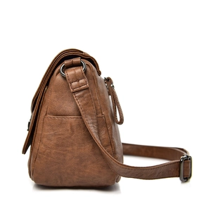 Retro dark brown soft leather shoulder bag for women shown from a side perspective
