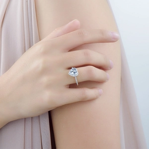 Sterling silver sparkling heart-shaped simulated diamond ring worn on a model's finger
