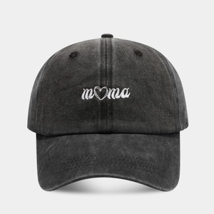 Close-up of mama embroidery with heart detail on washed cotton baseball cap texture
