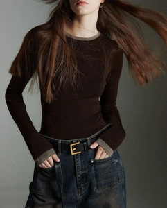 Detail of wool contrast knit top with layered collar and stylish slim fit sleeves