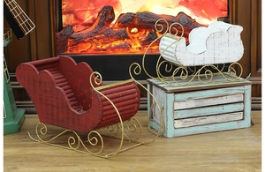 Christmas wooden sleigh decor set in red and white placed by a warm fireplace