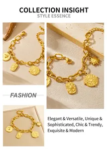 Close-up of vintage gold sun and heart pendants on a chunky stainless steel chain