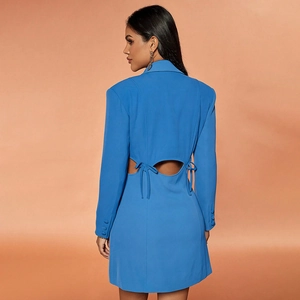 Detail of the back cutout and bow tie design on a blue V-neck long sleeve blazer dress