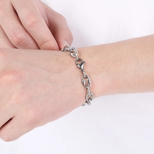 Close-up of a silver stainless steel chunky link chain bracelet with lobster clasp