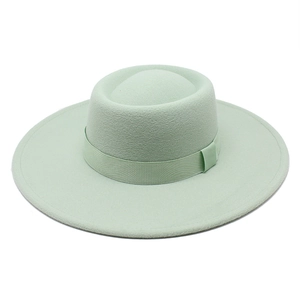 Minimalist mint green wool fedora hat with wide brim and matching decorative ribbon