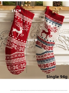 Detail showing 48cm knitted Christmas stocking with reindeer and snowflake patterns