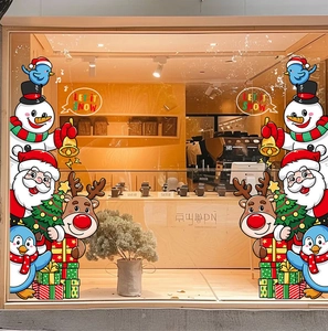 Christmas window static stickers featuring Santa, snowman and elk in a shop display