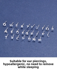 Macro display of full A-Z set of polished S999 sterling silver letter stud earrings
