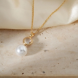 Collier élégant en acier inoxydable doré avec pendentif en cristal et grosse perle ronde