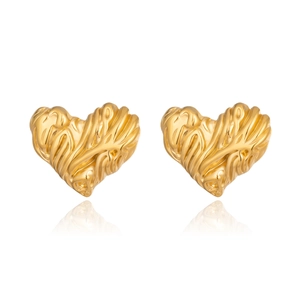 Macro shot of gold heart earrings featuring unique irregular wrinkled texture and high shine