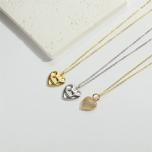 Three heart pendant necklaces in gold and silver finish with lava texture and crystals