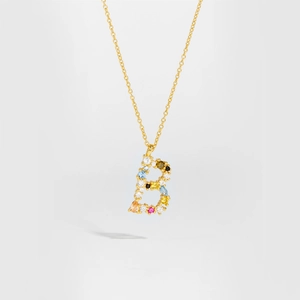 Detailed close-up of S925 silver gold necklace with a colorful gemstone letter B pendant