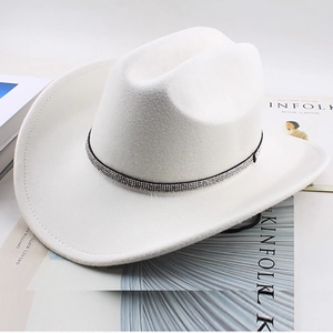 Detailed top view of white wool felt cowboy hat with sparkling rhinestone trim and wide brim