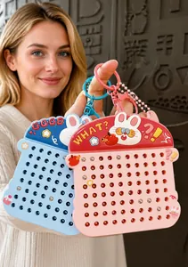 Close-up of bunny-shaped magnetic drawing board keychain in pink and blue, perfect for school bags.