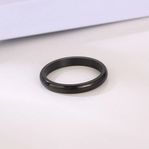 Macro shot of 3mm black polished stainless steel ring with a smooth rounded dome surface