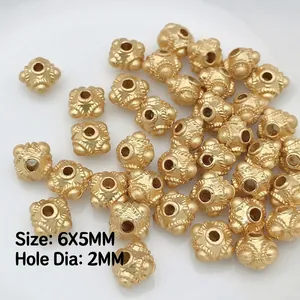 Macro view of 6x5mm vintage gold spacer beads with 2mm aperture for DIY jewelry