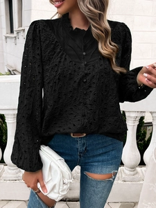 Detail of elegant black lace puff sleeve blouse with embroidery and high ruffled neck collar