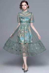 Elegant dark teal mesh maxi dress with floral embroidery and short sleeves in studio shot
