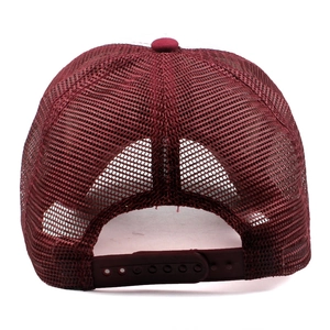 Detail view of burgundy mesh trucker hat with an adjustable plastic snapback closure