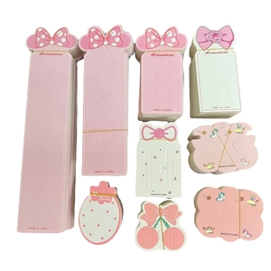 Pink and pastel hair accessory display cards with cute bow and unicorn patterns