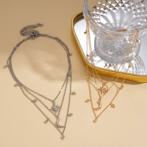 Three-layer layered necklace with star and moon pendants in gold and silver finishes