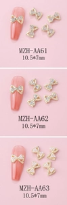 Detailed views of 10.5x7mm bow nail charms in gold alloy with crystal and pearl details