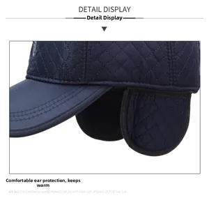 Detail of navy quilted ear flaps on baseball cap for winter windproof protection