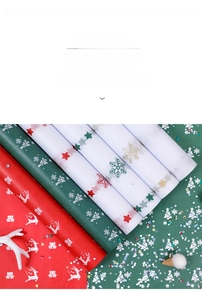Detailed Christmas tissue paper rolls with reindeer and snowflake prints for gift wrapping