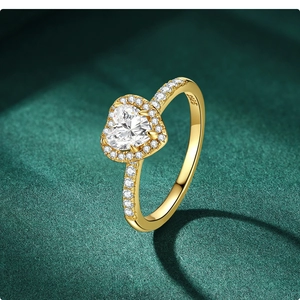 Macro shot of 18k gold plated 925 silver ring featuring heart-cut cubic zirconia stone