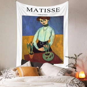 Detail view of Matisse Girl with Tulips tapestry hanging above a bedroom bed