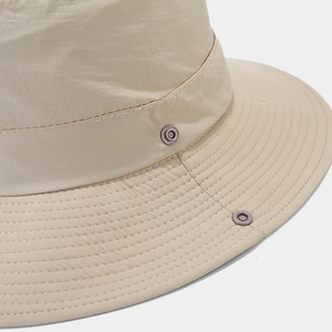 Beige wide brim sun hat with waterproof nylon texture and reinforced stitching